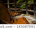 An old bench with fallen autumn leaves floating on it 143087091