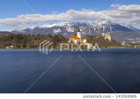 Bled lake with Bled catle, church and winter Julian Alps at background Bled lake with Bled catle, church and winter Julian Alps at background 143088906