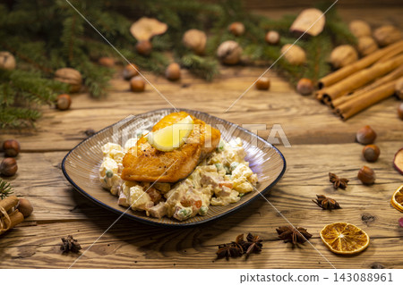 Christmas baked salmon with potato salad Christmas baked salmon with potato salad 143088961