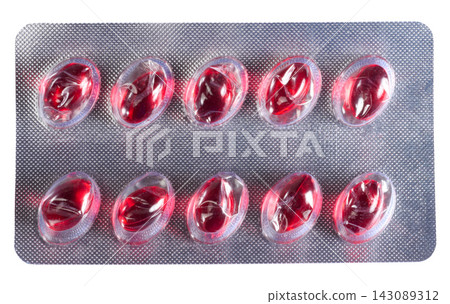 Blister pack with red gel capsules or vitamins in foil packaging Blister pack with red gel capsules or vitamins in foil packaging 143089312