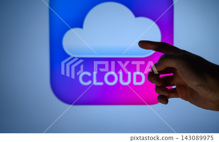 A hand pointing to a cloud icon and digital technology A hand pointing to a cloud icon and digital technology 143089975