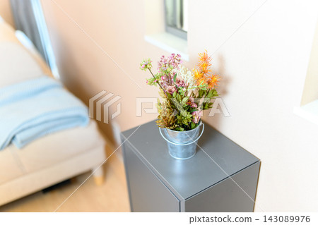 Flowers in a small bucket Flowers in a small bucket 143089976