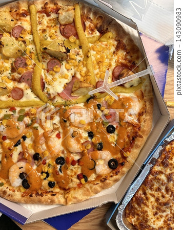 Hot and cheesy pizza slice with a crispy crust and savory toppings. A perfect mix of melty goodness and bold flavor for a satisfying comfort food favorite. Hot and cheesy pizza slice with a crispy crust and savory toppings. A perfect mix of melty goodness and bold flavor for a satisfying comfort food favorite. 143090983