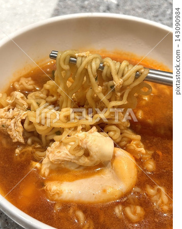 Shin Ramyun,close up of Ramyeon or Ramyun is a Korean-style soup noodle dish with a spicy flavor. Ramyeon or Korean instant noodles with egg - Korean food style Shin Ramyun,close up of Ramyeon or Ramyun is a Korean-style soup noodle dish with a spicy flavor. Ramyeon or Korean instant noodles with egg - Korean food style 143090984