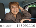 Joyful real woman passenger sitting in car, closeup portrait 143091110