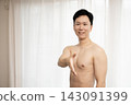 A shirtless Japanese man extends his right hand. 143091399