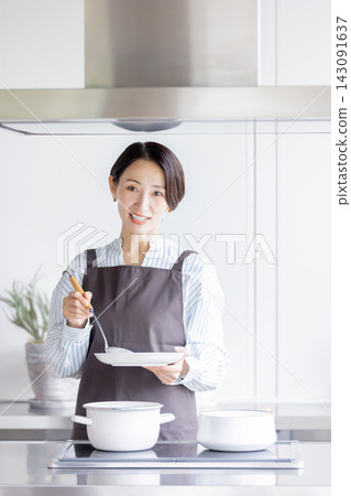 A Japanese female instructor explains the cooking process while plating the food in a cooking class. A Japanese female instructor explains the cooking process while plating the food in a cooking class. 143091637