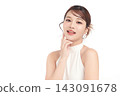 A beautiful young Asian woman with clean, fresh skin against a white background. Skincare, facial treatment, cosmetology, beauty, and spa. An elegant portrait of an Asian woman. 143091678