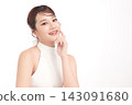 A beautiful young Asian woman with clean, fresh skin against a white background. Skincare, facial treatment, cosmetology, beauty, and spa. An elegant portrait of an Asian woman. 143091680