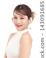 A beautiful young Asian woman with clean, fresh skin against a white background. Skincare, facial treatment, cosmetology, beauty, and spa. An elegant portrait of an Asian woman. 143091685