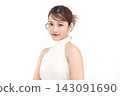 A beautiful young Asian woman with clean, fresh skin against a white background. Skincare, facial treatment, cosmetology, beauty, and spa. An elegant portrait of an Asian woman. 143091690