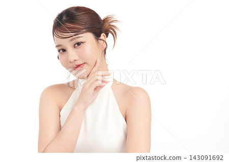 A beautiful young Asian woman with clean, fresh skin against a white background. Skincare, facial treatment, cosmetology, beauty, and spa. An elegant portrait of an Asian woman. A beautiful young Asian woman with clean, fresh skin against a white background. Skincare, facial treatment, cosmetology, beauty, and spa. An elegant portrait of an Asian woman. 143091692