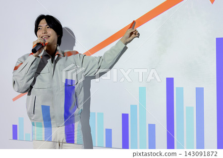 A young businessman explains business growth while pointing to an upward-sloping graph. A young businessman explains business growth while pointing to an upward-sloping graph. 143091872
