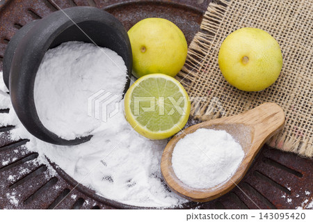 lemon and baking soda on the table lemon and baking soda on the table 143095420