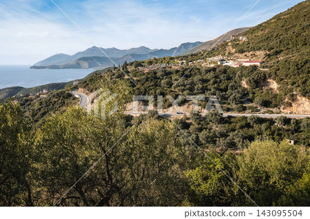 Mountain highway for a drive by the coast on a winding road in rural Albania. Mountain highway for a drive by the coast on a winding road in rural Albania. 143095504