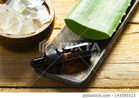 aloe vera leaves on a light and rustic background aloe vera leaves on a light and rustic background 143095521