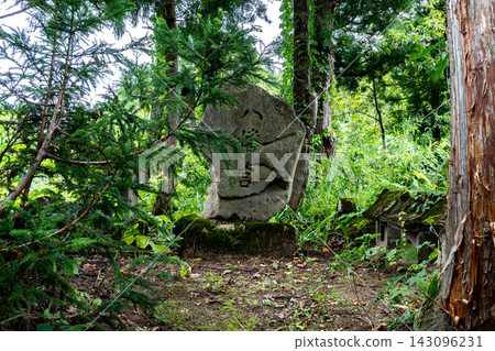 A stone monument of Hachiman Shrine in a cedar grove 143096231