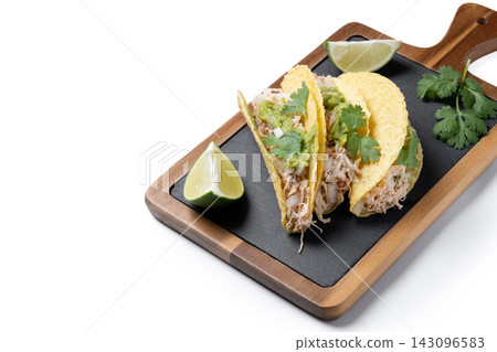Mexican chicken tacos with guacamole and cilantro Mexican chicken tacos with guacamole and cilantro 143096583