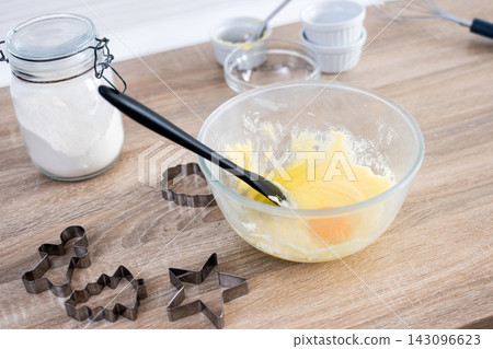 Christmas cookie dough with festive cutters Christmas cookie dough with festive cutters 143096623