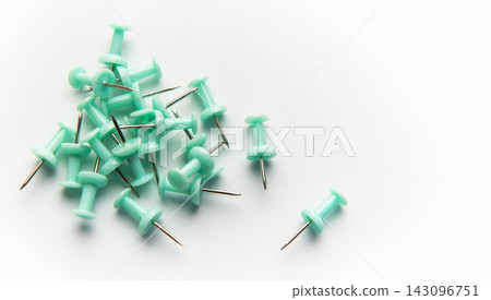 Teal pushpins creating heap on white background Teal pushpins creating heap on white background 143096751
