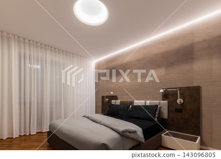 Contemporary Primary Bedroom With Upholstered Bed And Warm LED Lighting Contemporary Primary Bedroom With Upholstered Bed And Warm LED Lighting 143096805