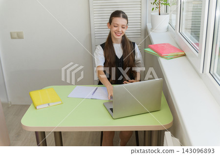 High School Student Having Online Lesson at Home High School Student Having Online Lesson at Home 143096893