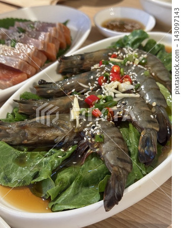 Korean soy sauce marinated raw shrimp with sesame seeds and chili Korean soy sauce marinated raw shrimp with sesame seeds and chili 143097143
