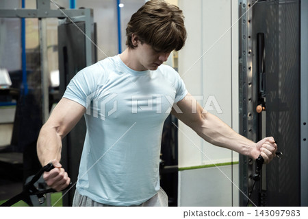 Chest fly man cable exercise. Workout Routine With Personal Trainer Chest fly man cable exercise. Workout Routine With Personal Trainer 143097983