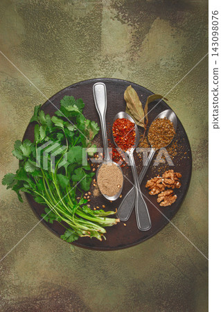 Georgian spices in spoons, on ketsi, top view, no people, Georgian spices in spoons, on ketsi, top view, no people, 143098076