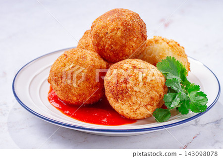 arancini appetizer with tomato sauce, on a white plate, homemade, no people, arancini appetizer with tomato sauce, on a white plate, homemade, no people, 143098078