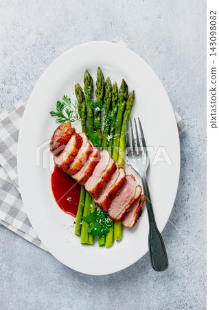 roast duck breast, with asparagus, with red sauce, on a white plate, homemade, no people, roast duck breast, with asparagus, with red sauce, on a white plate, homemade, no people, 143098082