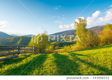 mountainous rural landscape of ukraine in spring. lovely view of valley fields. alpine meadow on a sunny afternoon. carpathian mountains countryside with forest near pasture. earth day background mountainous rural landscape of ukraine in spring. lovely view of valley fields. alpine meadow on a sunny afternoon. carpathian mountains countryside with forest near pasture. earth day background 143098352