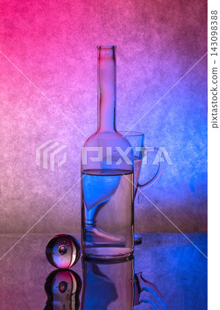 Still life with glass objects illuminated by blue and pink light Still life with glass objects illuminated by blue and pink light 143098388