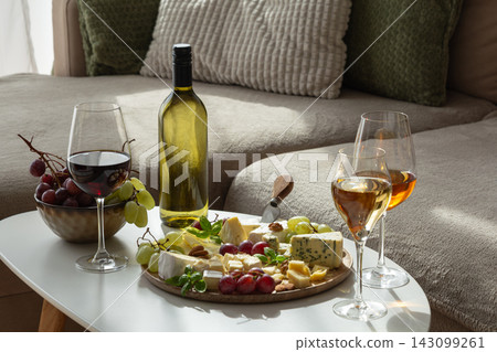 Elegant cheese and wine selection for sophisticated gatherings and relaxed evenings at home 143099261