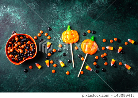 Halloween candy in shape of pumpkin jack-o-lantern Halloween candy in shape of pumpkin jack-o-lantern 143099415