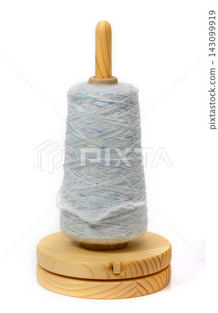 Spinning thread brings joy to crafts in a cozy warm room Spinning thread brings joy to crafts in a cozy warm room 143099919