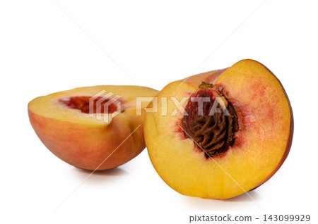 Commercial stock photo of two fresh ripe peach halves with a pit on a white background Commercial stock photo of two fresh ripe peach halves with a pit on a white background 143099929