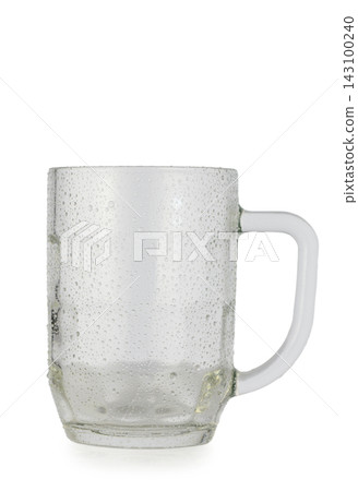 Wet empty faceted glass beer mug isolated on a white background Wet empty faceted glass beer mug isolated on a white background 143100240