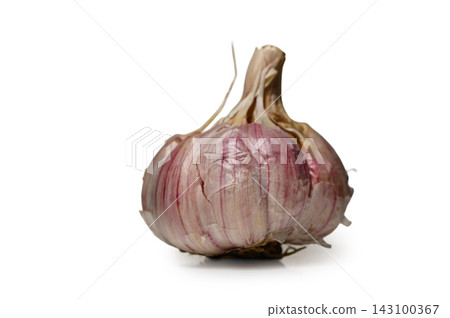 Commercial stock photo of a whole fresh purple-striped garlic bulb isolated on white Commercial stock photo of a whole fresh purple-striped garlic bulb isolated on white 143100367