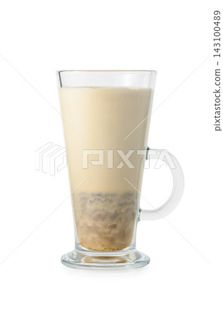 Stock photo of a tall glass mug filled with milk tea or blended coffee drink Stock photo of a tall glass mug filled with milk tea or blended coffee drink 143100489