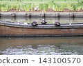 Mallard ducks resting on a small boat 143100570