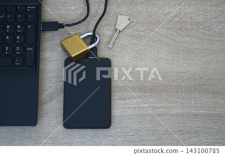 Cybersecurity concept - Physical lock on external SSD data storage. Cybersecurity concept - Physical lock on external SSD data storage. 143100785