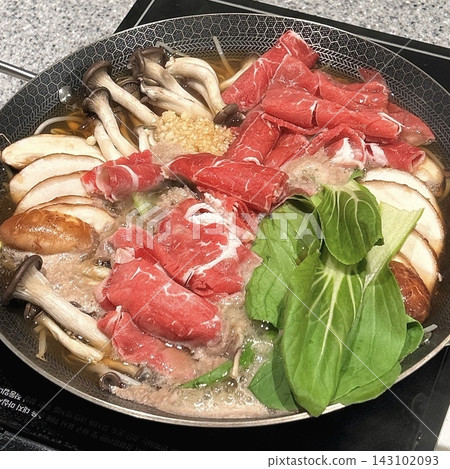 A bubbling hotpot with rich broth, tender meats, fresh vegetables, and noodles simmered to perfection. Ideal for a communal meal bursting with bold, hearty flavors. A bubbling hotpot with rich broth, tender meats, fresh vegetables, and noodles simmered to perfection. Ideal for a communal meal bursting with bold, hearty flavors. 143102093