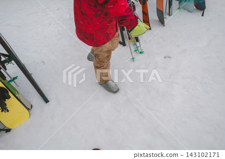 Walking on the ski slopes in ski boots Walking on the ski slopes in ski boots 143102171