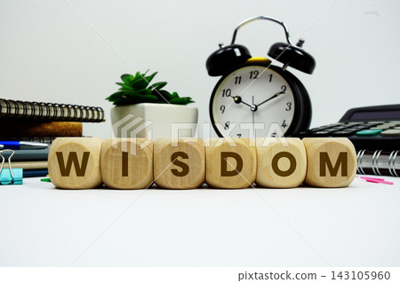 WISDOM alphabet letters with alarm clock and calculator on white background WISDOM alphabet letters with alarm clock and calculator on white background 143105960