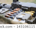Close Up of Ammunition Belt Loaded Into Heavy Machine Gun 143106115
