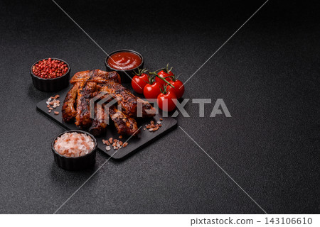 Grilled pork or beef ribs seasoned with salt and spices, served in sauce. Grilled ribs Grilled pork or beef ribs seasoned with salt and spices, served in sauce. Grilled ribs 143106610