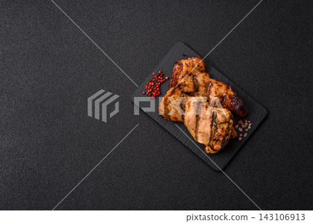 Grilled chicken breast seasoned with salt and spices. Grilled chicken Grilled chicken breast seasoned with salt and spices. Grilled chicken 143106913