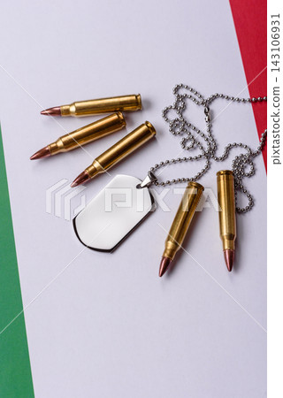 A dog tag on the Italian flag, serving as a conceptual backdrop representing Europe's defense 143106931
