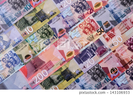 Ghana, Ghanaian paper money, cedi banknotes as currency for exchange or travel. Ghana money Ghana, Ghanaian paper money, cedi banknotes as currency for exchange or travel. Ghana money 143106933